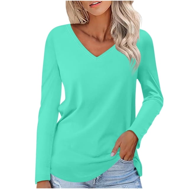 Timegard Women's Tops V-Neck Long Sleeve Basic Tee in a solid light turquoise color. This casual tunic top features a relaxed fit with clean lines and a simple silhouette, ideal for layering with cardigans or jackets. Made from soft, breathable fabric, it is suitable for spring, summer, and fall. Shown styled with denim shorts.