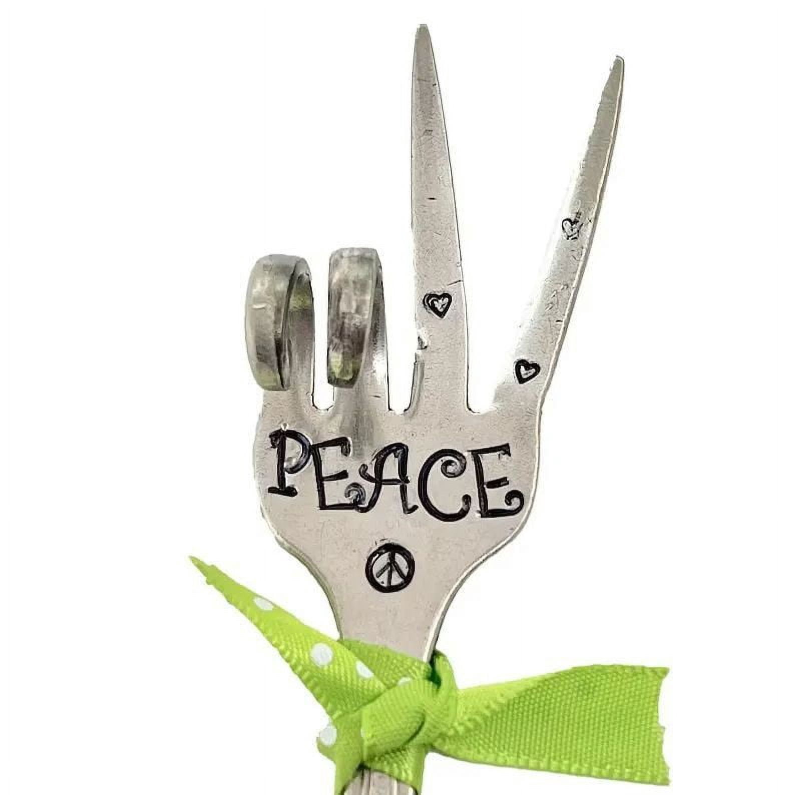 Rempotage de Jardin Décoré avec des Cuillères en Fer Forgé