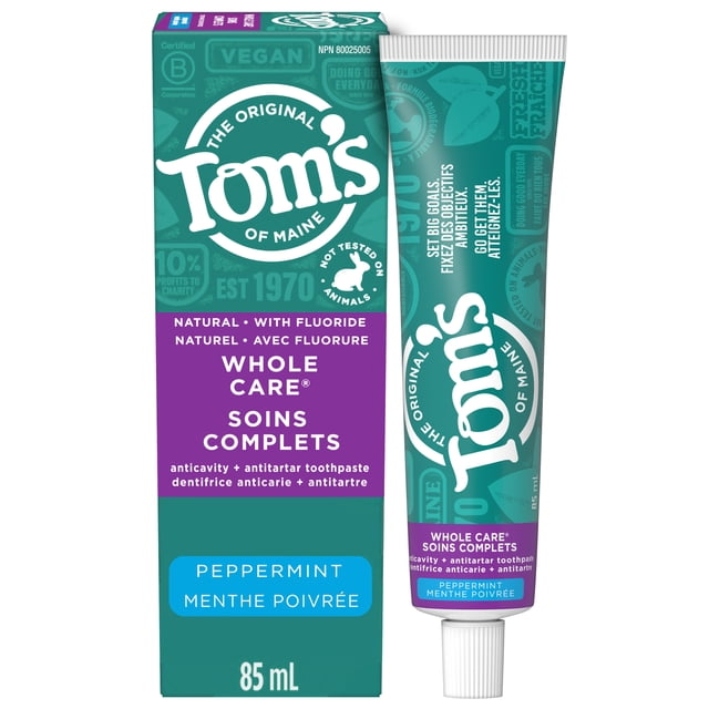 Tom’s of Maine Whole Care Natural Toothpaste with Fluoride, Peppermint, 85mL showing a teal and purple box and tube. This anticavity toothpaste helps prevent cavities, remineralize tooth enamel, and freshen breath with peppermint flavour. It is vegan and cruelty-free.