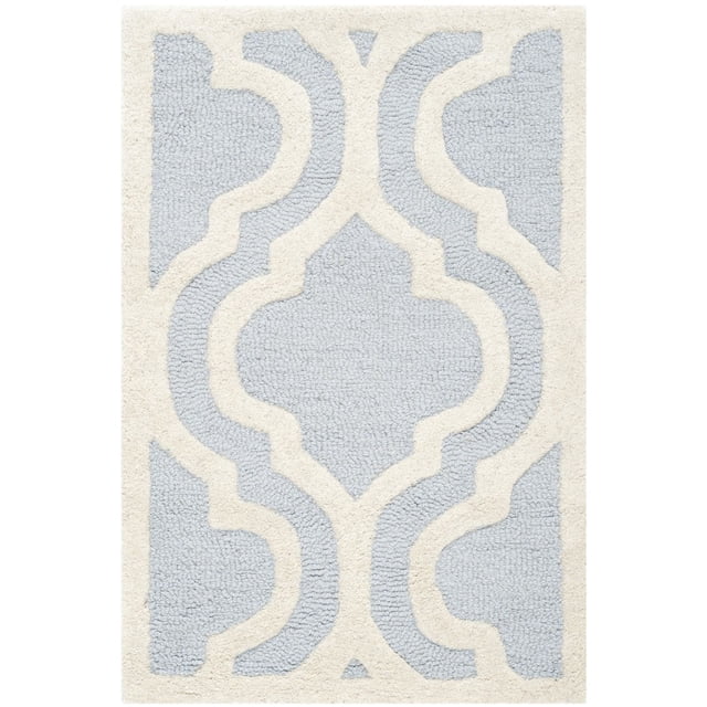 Safavieh Cambridge Kirsten area rug featuring a light blue and cream geometric pattern with a plush, textured surface.