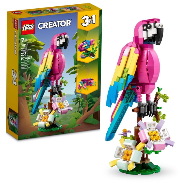 LEGO Creator Exotic Pink Parrot 31144 Building Toy Set (253 Pieces) A centered, front-facing view of the assembled vivid pink-and-blue parrot perched on a brown tree branch; a LEGO Creator 3in1 build for ages 7+ that can be rebuilt into a fish or a frog; posable model with a fully rotating body and movable wings, tail and fins; measures 22 cm high. Often used as a colorful display or desktop model.