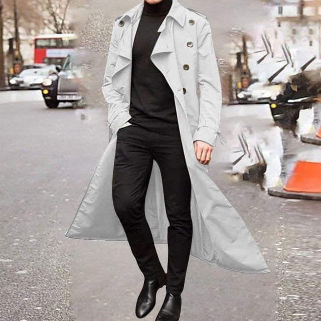 TIMIFIS Mens Overcoat Winter Full Length Trench Coat Warm Long Jacket Formal Outerwear-WhiteFall. A full-length white trench coat for men with a lapel collar, button closure, and long sleeves. The coat is styled for winter wear, combining warmth and fashion. The model pairs it with black pants and a turtleneck, standing on a city street with blurred traffic in the background.