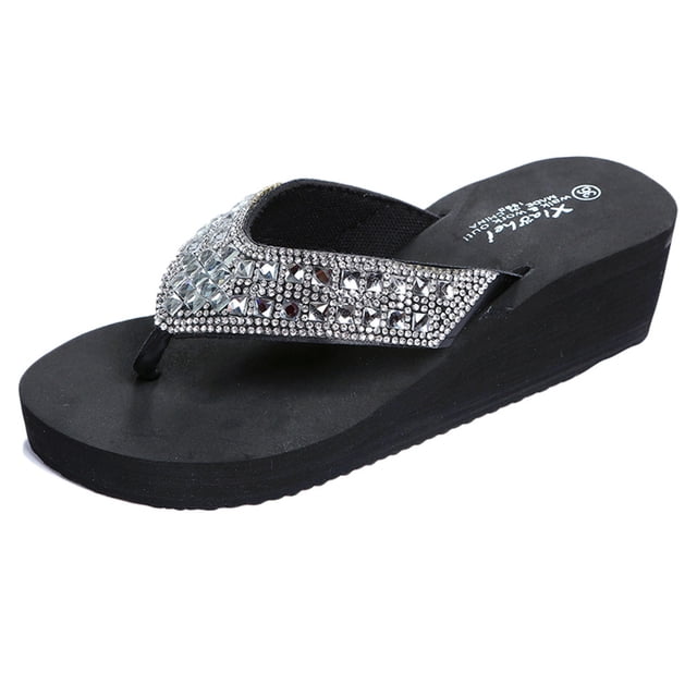 Summer Slippers Fashion Rhinestones Wedges Flip Flops Womens Casual Beach Shoes featuring a black EVA sole with a 5cm wedge heel and 3cm platform. The upper is made of PU material adorned with sparkling rhinestones in a geometric pattern. Designed with a slip-on style and round toe, these sandals are ideal for casual, fashion, or beachwear during spring, summer, or autumn.