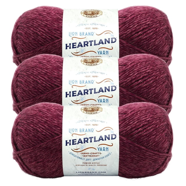 Lion Brand Yarn Heartland Yarn 3Pack showing three skeins of medium worsted weight acrylic yarn in a heathered burgundy colour, each wrapped with a white label featuring the Heartland brand and product details, suitable for knitting, crochet, and crafting warm accessories.