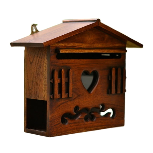 Rongfmy Retro Locking Mailbox Rural Wall Mount Wooden Mailbox Suggestion Box Mail. A solid wood mailbox with a rustic design featuring a heart-shaped cutout, decorative carvings, and a slotted opening for mail. The mailbox has a slanted roof and is suitable for wall mounting in outdoor or indoor settings, ideal for garden décor or patio decoration. Dimensions are 25x26x12cm (9.84x10.24x4.72 inches).