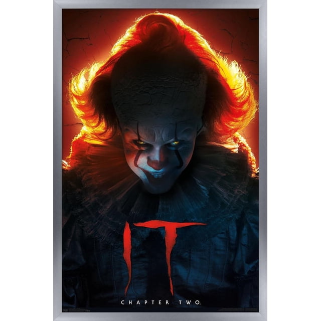IT: Chapter 2 - Evil Glow Wall Poster, 22.375" x 34" depicting a dark figure in a ruffled collar costume backlit by a vivid red-orange glow highlighting fiery hair, set against a cracked textured background with the red 'IT' title and 'Chapter Two' text below, ideal for horror-themed wall art.