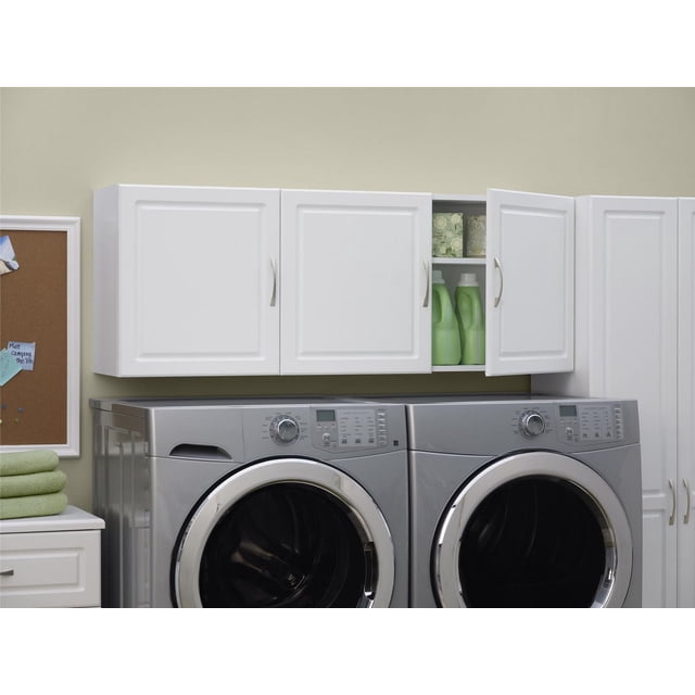 DOREL 54" Wall Cabinet in white with three doors and brushed metal handles, mounted above a silver front-load washer and dryer, one door open showing green detergent bottles and storage boxes inside, featuring adjustable shelves for laundry essentials and maximizing wall storage space.