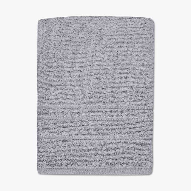 Mainstays Solid Bath Towel in grey, folded flat to show its textured cotton/polyester blend fabric with a horizontal band near the edge, measuring 25.5 by 47.5 inches, bleach-safe, quick-drying, and durable for everyday bathroom or gym use.