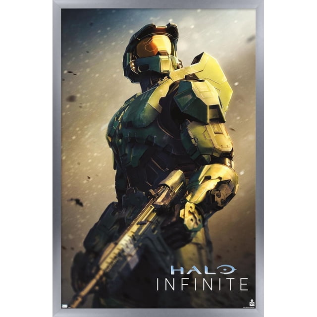 Halo Infinite - Become Wall Poster, 22.375" x 34" framed depicting Master Chief in green and gold armor holding an assault rifle against a smoky blurred background with the Halo Infinite logo, suitable for decorating bedrooms, offices, or gaming rooms.
