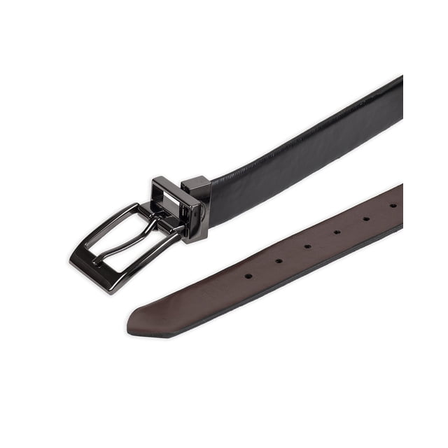Dickies Ceinture Habillée Réversible en Cuir pour Garçons avec Boucle Torsadée en Métal Canon Foncé et Bord Plumes. la Ceinture Mesure 1 1/8 Pouce de Large et Est Faite de Cuir, avec une Fonction Réversible Qui Passe du Noir au Brun Légèrement Marbré. l'Image Montre la Ceinture Étendue, Mettant en Valeur les Côtés Noirs et Bruns et le design Contemporain à Boucle.