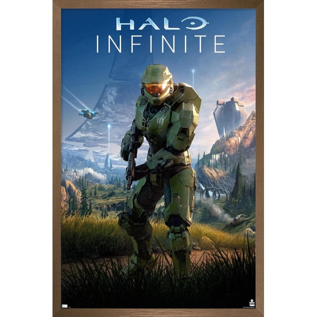 Halo Infinite - Primary Vertical Wall Poster, 22.375" x 34" featuring a centered front-facing Master Chief in green armor holding a rifle, set against a detailed sci-fi landscape with mountains, futuristic structures, and flying vehicles under a blue sky. This Trends International framed poster has a premium satin finish and lightweight wood frame, ideal for home décor, gaming rooms, or dorms, and suitable as stylish wall art for themed parties or gifts.