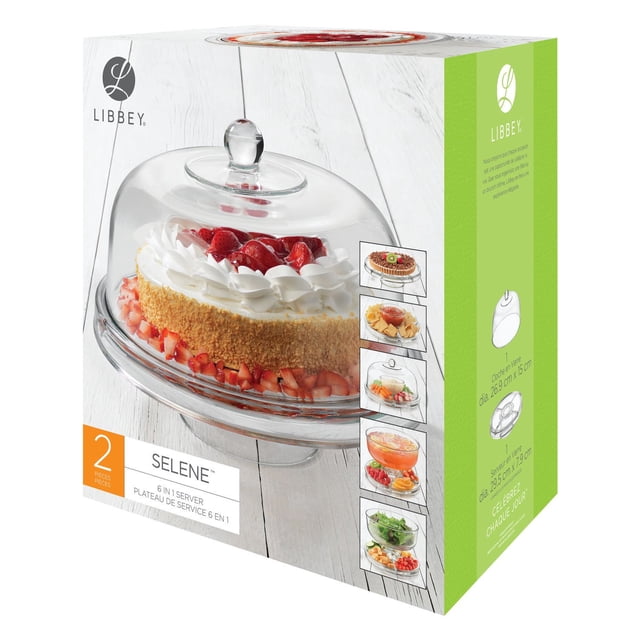 Libbey Selene Ensemble de Service 6-en-1 avec Dôme en Verre Transparent et Plateau sur Pied Tenant un Gâteau aux Fraises sur une surface en Bois Blanche, Conçu pour de Multiples Usages Incluant Dôme à Gâteau, Plateau à Condiments, Serveur pour Croustilles et Trempettes, Bol à punch et Bol à Salade, Convient aux Réceptions Polyvalentes à la Maison.