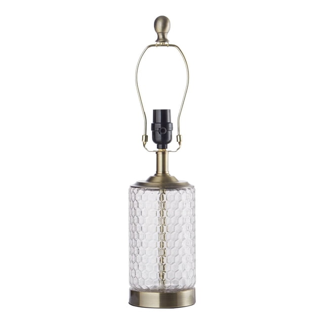 hometrends Table Lamp featuring a clear glass base with honeycomb texture and satin brass accents on the base and lamp holder, designed for table lamp lighting and decorative use, shown without a lampshade on a white background.