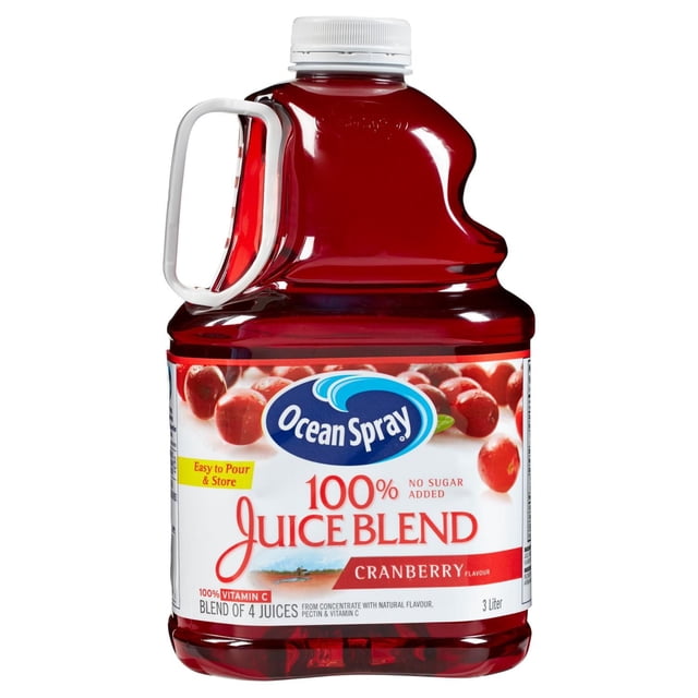 Ocean Spray 100% Juice Blend Cranberry in a 3-liter clear plastic jug with a white handle and cap, featuring a label with red cranberries and text highlighting no sugar added, 100% vitamin C, and a blend of four juices, often used for drinking or mixing with other beverages.