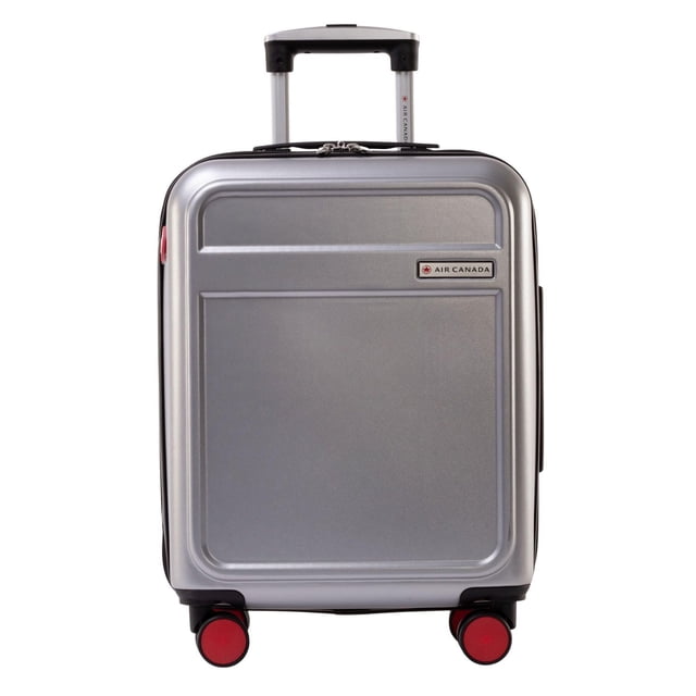 Air Canada Magnum Carry-On Hardside Luggage 20 Inch Carry On Spinner Suitcase in silver with a durable ABS/PC hard shell, retractable push-button handle, four red 360° spinner wheels for smooth airport mobility, and Air Canada logo badge, ideal for organized travel.