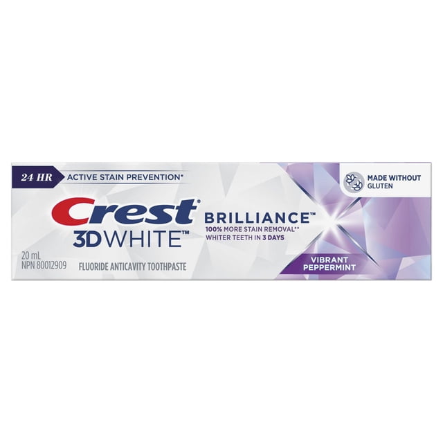 Crest 3D White Brilliance Vibrant Peppermint toothpaste 20 mL tube packaging featuring 24 hour active stain prevention, fluoride anticavity formula, gluten-free label, and claims of 100% more stain removal with whiter teeth in 3 days on a white and purple geometric background.