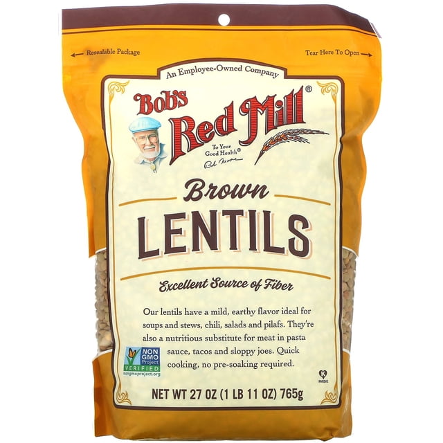 Bob's Red Mill Brown Lentils, 27 oz (765 g), packaged in a resealable bag. The front of the package emphasizes features like being an excellent source of fiber, Non-GMO Project Verified, and Kosher Pareve. These lentils are quick-cooking and require no pre-soaking, with a mild, earthy flavor suitable for soups, stews, salads, pilafs, and as a meat substitute in pasta sauces and tacos. The package design is orange and beige with the brand logo prominently displayed.