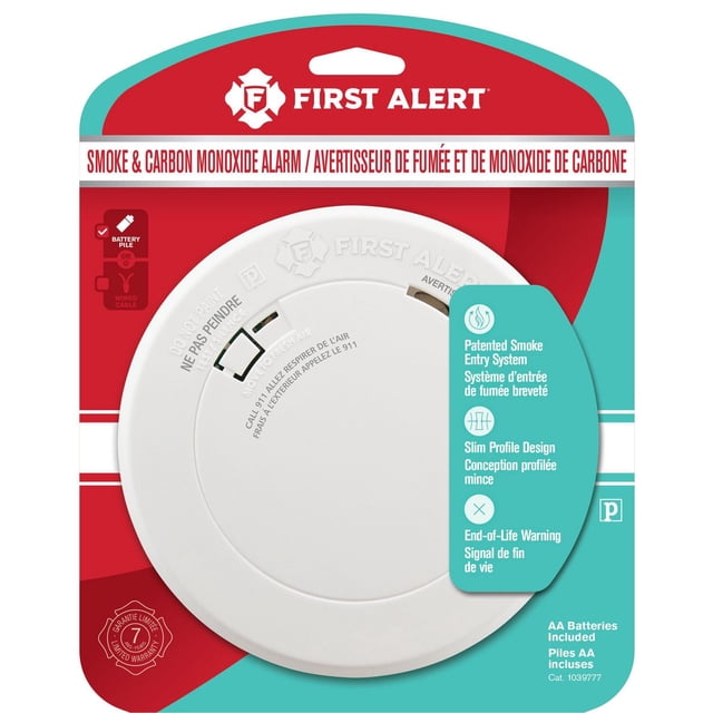 First Alert BRK PRC700A battery-operated smoke and carbon monoxide alarm with slim white circular design, patented smoke entry system, end-of-life warning, and AA batteries included, shown on bilingual red and teal packaging for home safety.