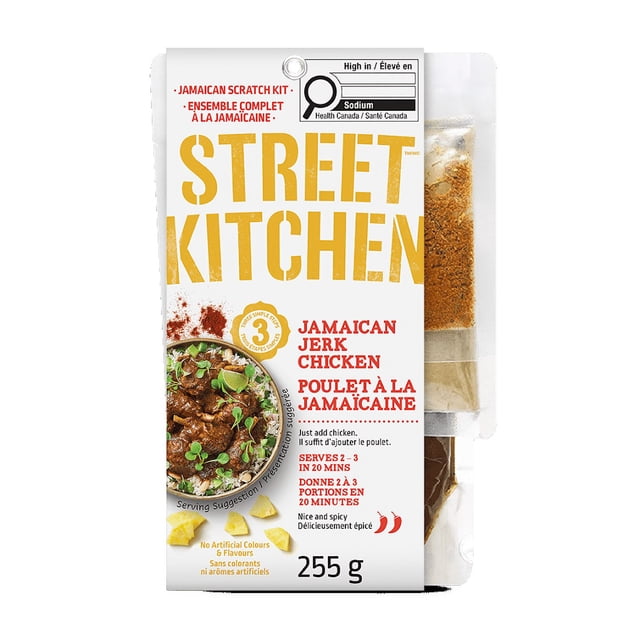 Street Kitchen Jamaican Jerk Chicken Kit 255g featuring seasoning packets in a white package with bold yellow and red text, showing a serving suggestion of spicy jerk chicken over rice with herbs and lime, ready in 20 minutes for 2-3 servings, free from artificial colours and flavours, suitable for quick Caribbean-style marinades and cooking sauces.