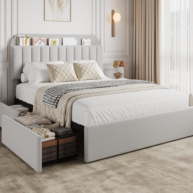PIONEERWORKS Queen Bed Frame with Storage Headboard, Boucle Upholstered Platform Bed with Bookcase & 2 Drawers, shown in a grey boucle fabric. The bed features a vertical channel-patterned headboard with built-in bookcase storage for books and personal items. Two rolling drawers at the base provide additional storage for clothes or bedding. The bed is displayed in a modern bedroom with neutral decor, emphasizing its contemporary design and functionality. No box spring is needed, and the sturdy metal frame with wooden slats ensures durability and noise-free use.
