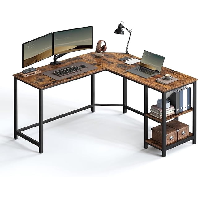 VASAGLE L-Shaped Computer Desk, Corner Desk, 54-Inch Writing Study Workstation, Rustic Brown and Black 3/4 profile of an L-shaped corner workstation with a 138 x 138 cm desktop, rustic brown particleboard tops and black steel frame with crossbars, removable middle shelf, rear corner cable cutout and adjustable feet; often used for multi-monitor office or as a compact crafting station.