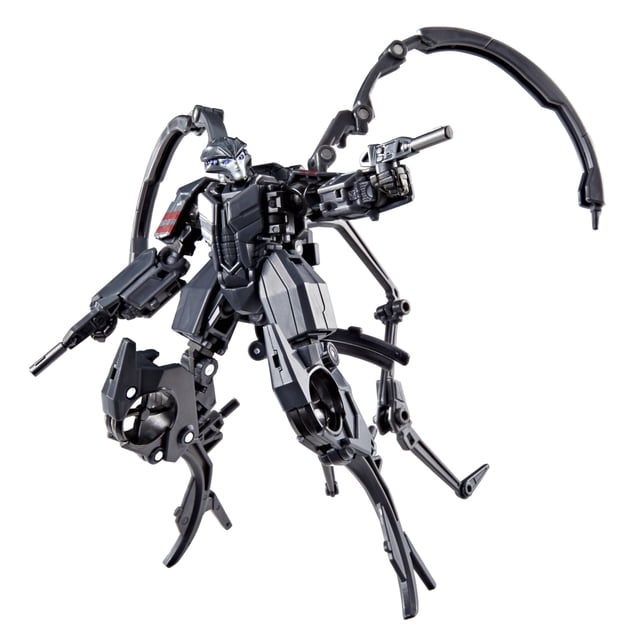 Transformers One Studio Series Deluxe Class Airachnid Action Figure in black and dark gray robot mode with articulated limbs and four spider-like appendages, holding two detachable blaster accessories, designed for display and play in the TV & Movie Action Figures category.