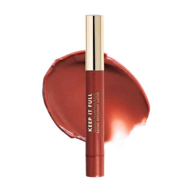 Milani Keep It Full Glossy Plumping Balm in a slim tube with gold cap, shown front-facing over a warm terracotta lip balm swatch, emphasizing its hydrating, glossy lip plumper formula.