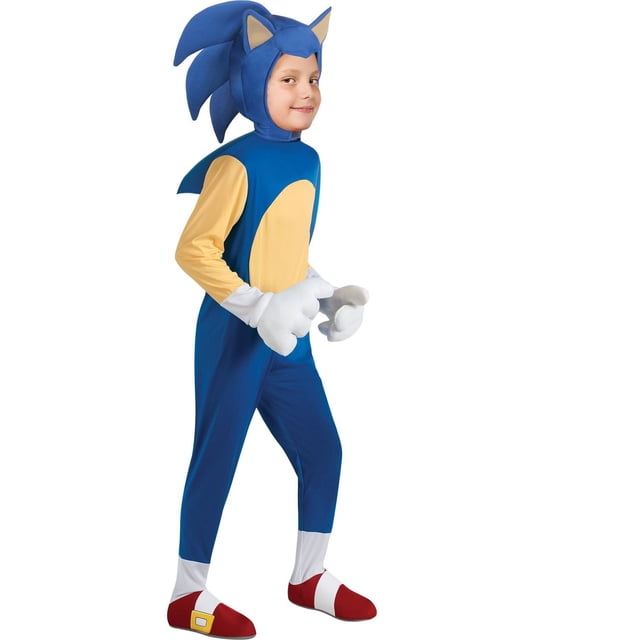 Sonic the Hedgehog Sonic Boy's Deluxe Costume featuring a blue plush jumpsuit with beige long sleeves and a circular beige chest patch, attached red and white shoe covers, white gloves, and a large character headpiece with blue spikes and beige ears, shown in a side pose suitable for Halloween dress-up.