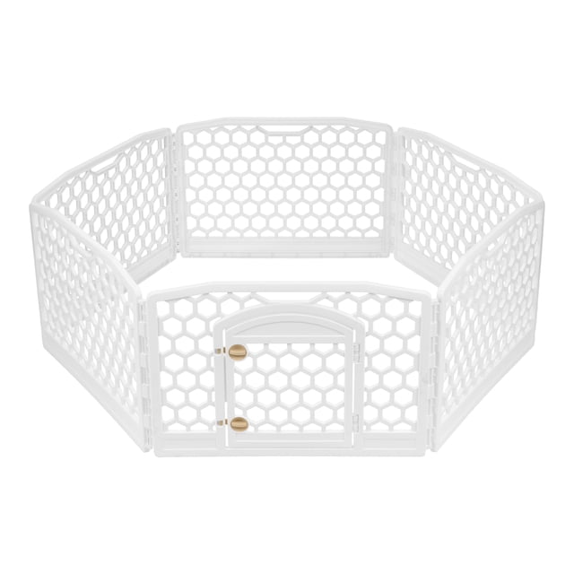 IRIS 61 cm (24 in) Dog Exercise Playpen in white with six molded plastic panels featuring a honeycomb design. Includes a built-in door panel with secure latches, non-skid rubber feet for stability, and a lightweight, portable design. Suitable for indoor and outdoor use, ideal for small pets.