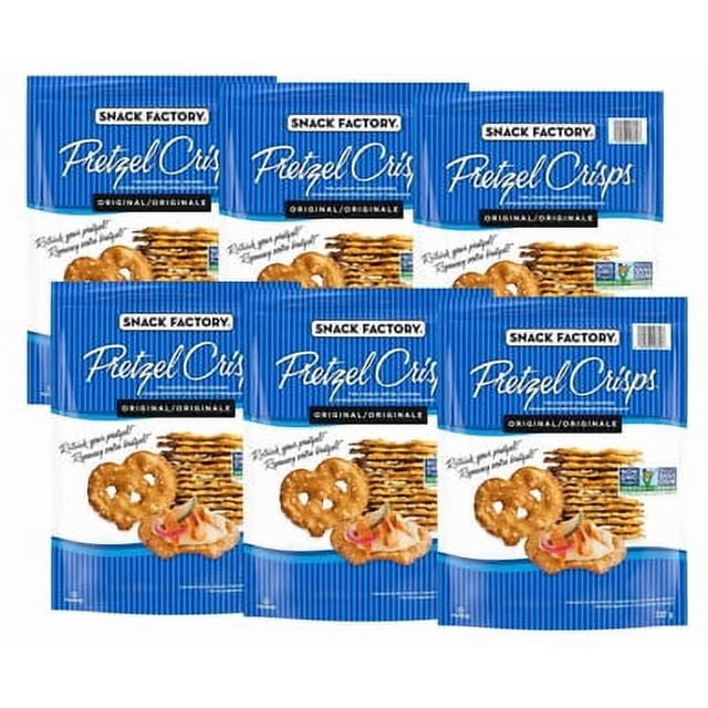Snack Factory Pretzel Crisps 737g - Original Pretzel Crackers in a 6-pack. The image shows six blue packages of thin, crunchy pretzel crackers with the Snack Factory branding. Each package highlights the original flavor and non-GMO certification. The crackers are displayed with a serving suggestion featuring a dip and toppings.
