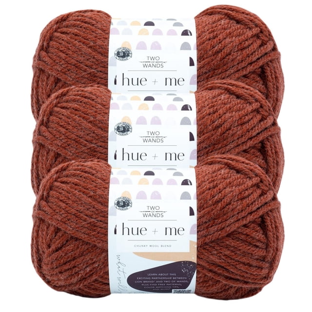 Lion Brand Hue + Me Yarn bulky weight shown as three skeins stacked vertically with white labels featuring the Two of Wands logo and text indicating a chunky wool blend ideal for knitting accessories, garments, blankets, and home décor, suitable for machine washing and drying.