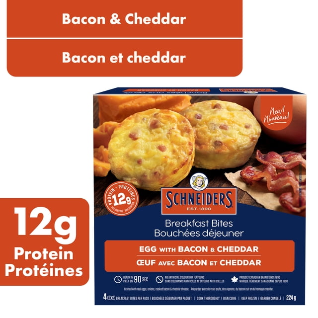 Schneiders Egg with Bacon & Cheddar Breakfast Bites box showing four round, fluffy breakfast bites with cooked bacon and cheddar cheese, providing 12g protein per serving and ready in 90 seconds for a quick frozen breakfast option.