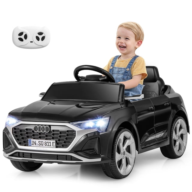 Gymax Voiture Électrique 12 V pour Enfants Ride On en Noir avec Télécommande, avec Quatre Roues avec suspension, Trois Réglages de Vitesse et Phares DEL. la Voiture Est Montrée avec un Enfant Assis, Tenant le Volant, et Comprend une Télécommande Blanche. Conçue pour les Enfants de 3 Ans et Plus, Elle Offre des modes de Télécommande Manuelle et Parentale, une Fonction de Démarrage Lent, et une Expérience de Conduite Réaliste avec Musique, Contrôle du volume et Affichage de la Puissance. la Voiture Mesure 38,5 Pieds' x 19 Pieds' x 17 Pieds' et Supporte jusqu'à 66 Lb