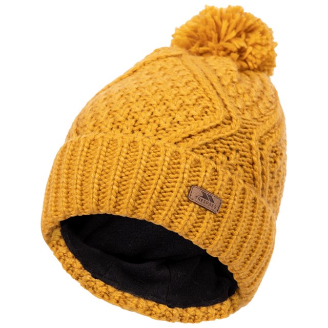Trespass Tuque à Pompons pour Femmes Tricotée Super Douce Zyra en Jaune Moutarde. Fabriquée en Fil Islandais pour une Sensation Super Douce, avec un design Tricoté Texturé, un Pompon Ludique et un badge en Similicuir. Son Double style Lui Permet de Se Porter comme Tuque Ajustée Ou Bonnet Ample. Idéale comme Accessoires d'Hiver pour Femmes, Offrant Chaleur et Confort avec une Doublure 100 % polyester.