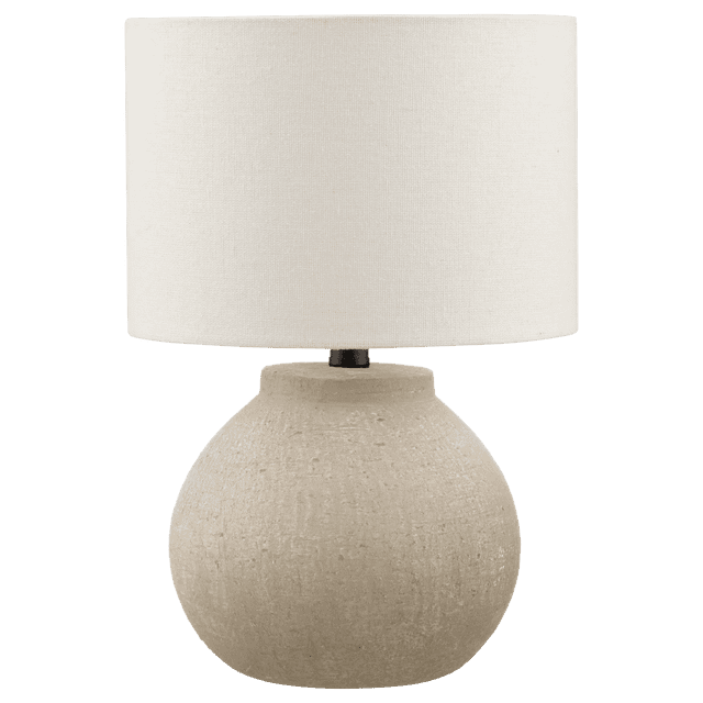 Bouclair Modern Textured Concrete Beige Ceramic Table Lamp — front-facing round silhouette with heavily textured beige ceramic base that mimics a concrete look, white drum shade and dimmable function; artisan handcrafted finish suitable for a nightstand or side table, often used as bedside reading or ambient lighting.