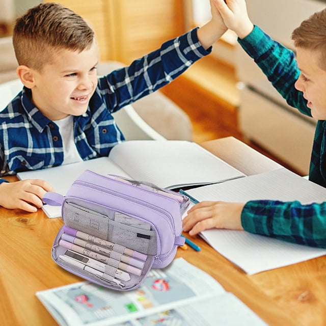 Matoen Solid Color Pencil Case Large Capacity Four Open Pencil Case Stationery Box for Men and Women. The lavender pencil case, made of durable polyester fabric, features multiple compartments, including zippered sections and mesh pockets, for organizing pens, markers, and other stationery. It is displayed open on a wooden desk surrounded by study materials, with two children studying nearby.