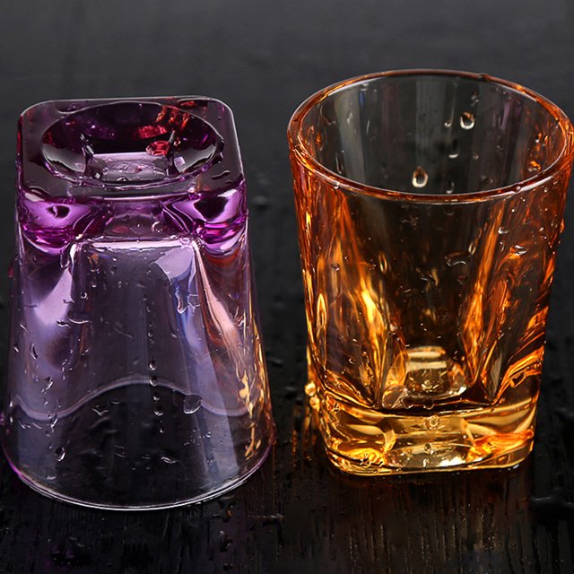 OULII 3Pcs Small Drinking Glasses Cup Acrylic for Adults Home Use. Two acrylic drinkware pieces are displayed, one upright and one upside down, showcasing a transparent design with vibrant orange and purple tones. The square shape and circular bottom provide stability and elegance, ideal for serving beverages like water, juice, cocktails, or soda in home or restaurant settings.
