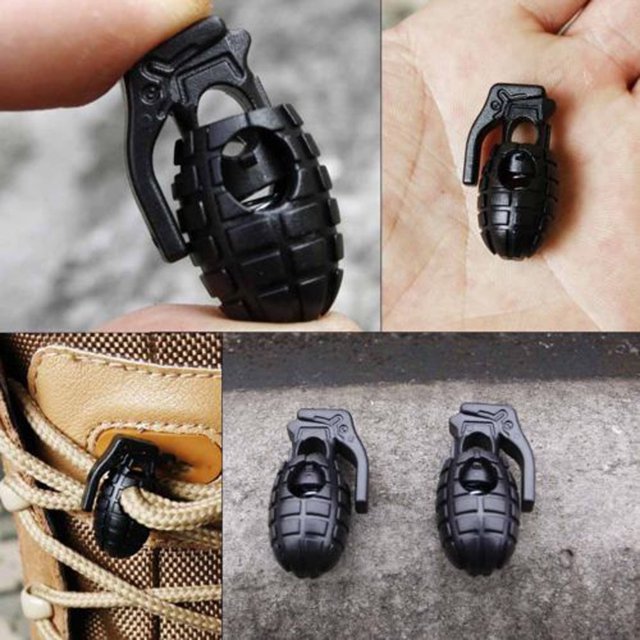 10-pack outdoor hiking shoe lace buckle clips with a grenade-shaped design in durable black plastic. These small, non-slip gear locks (3x1.5cm) are shown securing shoelaces on hiking boots and displayed in hand for size reference. Multi-use for shoelaces, paracord, and rope securing.