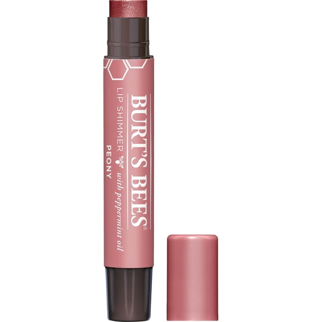 Burt’s Bees® 100% Natural Lip Shimmer, Peony, close-up of a pink tube with dark coral shimmer balm extended, labeled with white text and hexagon graphics, moisturizing lips with shea butter and peppermint oil, cap removed and placed beside it.