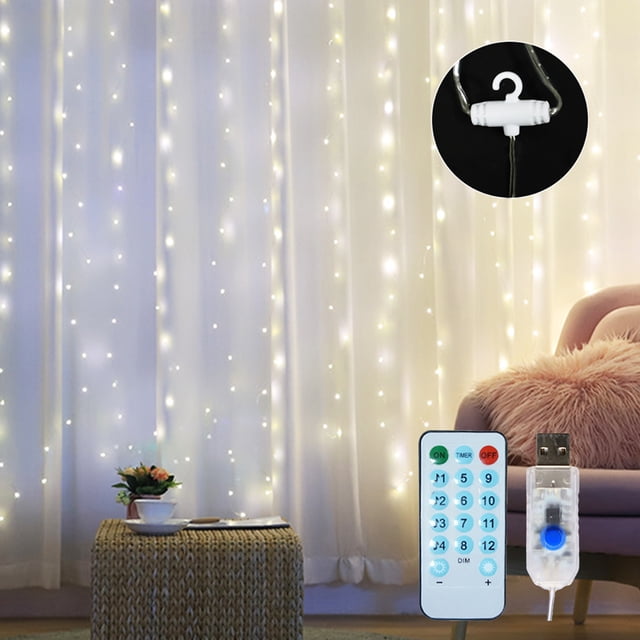Amdohai Rideau Féerique 10 X 10 Pieds 300 LED en Blanc Chaud, Suspendu Élégamment contre un Fond de Rideau Blanc. Doté d'Une Alimentation USB, d'Une Télécommande et de 8 modes d'Éclairage pour une ambiance Dynamique. Convient à une Utilisation Intérieure et Extérieure, Y Compris les Fêtes, les Jardins et les Événements Festifs.
