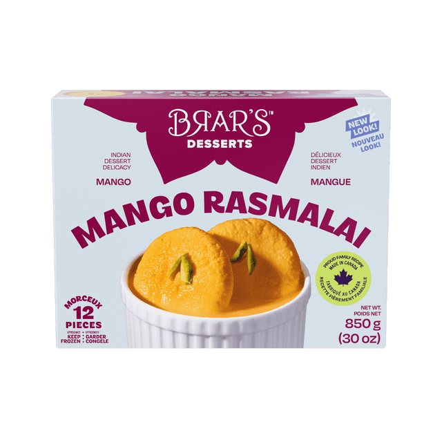 BRAR'S MANGO RASMALAI showing two flattened cheese curd balls soaked in mango-flavored clotted cream and cooked in sugared milk, garnished with pistachio slices, served in a white ramekin, with packaging indicating 12 pieces and 850 g (30 oz) net weight, ideal as a dessert or snack.