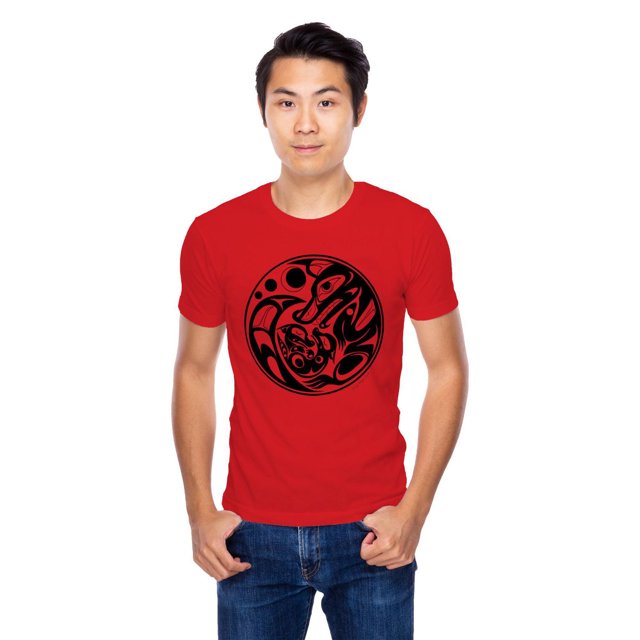 Red adult tee featuring an Indigenous-inspired black wolf graphic in circular form, worn by male model.