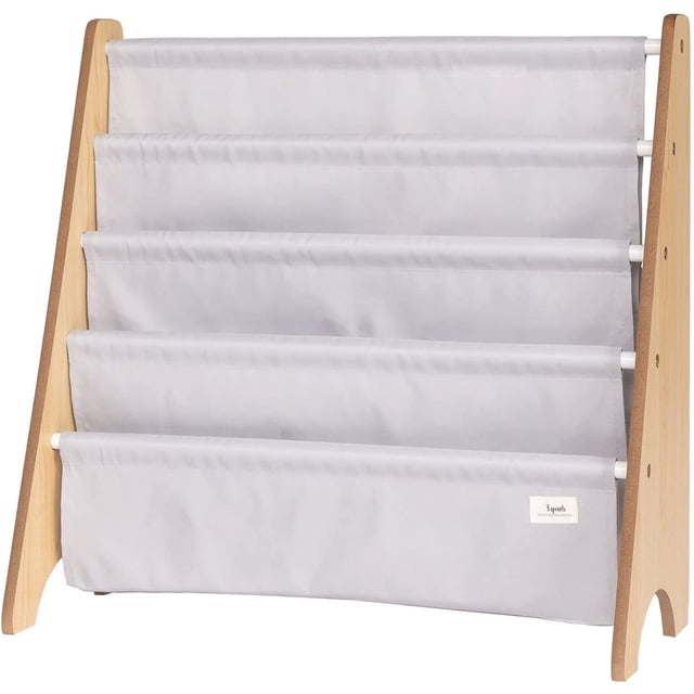 3 Sprouts Recycled Fabric Kids Book Rack Storage Bookshelf Organizer in Light Gray for Ages 3+. A front-facing view of a light gray 4-pocket book rack with a wooden frame, designed to keep books at a child's level. Ideal for creating a reading nook in kids' bedrooms or playrooms.
