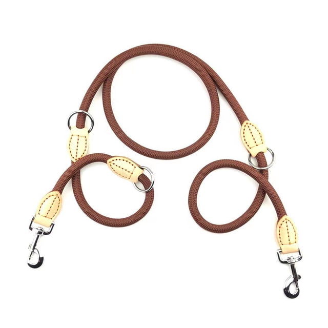 Double dog leash for large and small dogs, featuring a no-swivel rotation design and durable brown rope construction with beige accents. The leash includes dual strong connectors and adjustable length for walking two dogs simultaneously. Suitable for small and large breeds, with reinforced bungee parts for shock absorption and easy-grip handles for control.