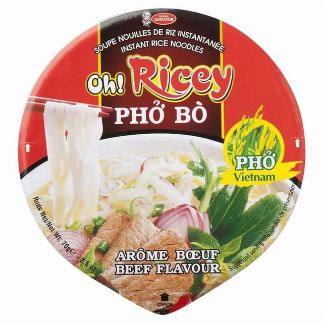 Oh! Ricey Beef Flavour Rice Noodle Bowl with instant rice noodles in clear broth, featuring beef slices, green onions, red onions, and fresh herbs on the packaging lid, ready in 3 minutes, product of Vietnam, suitable for quick and convenient Vietnamese pho meals.
