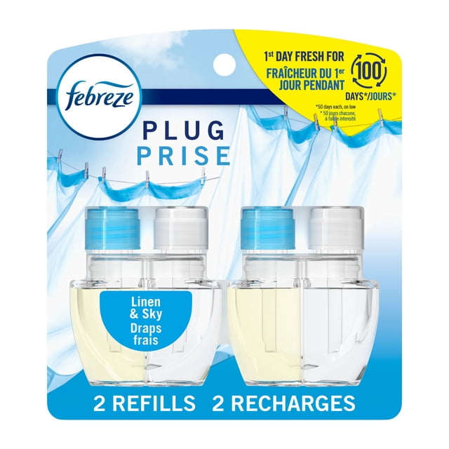 Febreze Plug In Air Freshener Linen & Sky Scent refill pack with two clear oil bottles with blue and white caps, featuring Fade Defy technology for 50 days of continuous odor-fighting freshness, shown with white linens hanging on a clothesline under a blue sky.