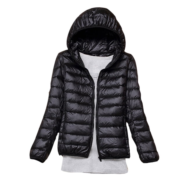RKSTN Puffer Jacket Womens Winter Fashion Solid Color Lightweight Hooded Short Korean Style Jacket Plus Size Full Zipper Warm Jacket with Pockets. The image shows a black, lightweight puffer jacket with a hood and full zipper closure. The jacket features a quilted design, long sleeves, and a short length, suitable for winter wear. Made from polyester, it is designed to be warm, windproof, and comfortable. The jacket is styled over a light grey top, emphasizing its casual and versatile look.