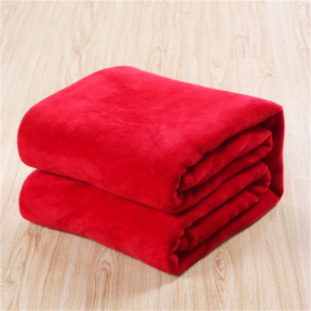 Super Soft Throw Blankets Super Soft Warm Solid Warm Micro Plush Fleece Blanket Throw Rug Sofa Bedding in a vibrant red color. Made from flannel material, this 100x140cm blanket offers durable warmth and a soft texture, ideal for sofas, beds, or as a throw rug. The blanket is machine washable and easy to maintain.