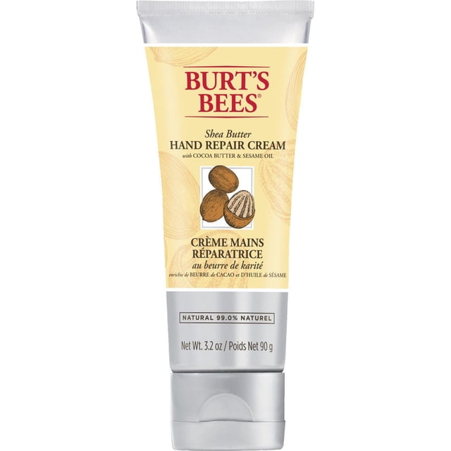 Burt’s Bees Shea Butter Hand Repair Cream 90g tube with beige and silver packaging, featuring shea nut illustrations and text highlighting cocoa butter, sesame oil, and 99.0% natural origin, suitable for daily hand hydration and repair.