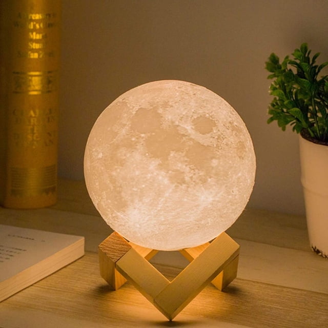 Moon Lamp Moon Light Night Light for Kids Gift displayed on a wooden stand. The lamp features a realistic 3D-printed moon surface with dual-color functionality, offering white and yellow light options. It includes a touch control for brightness adjustment and a rechargeable battery lasting 4-8 hours after a 2-3 hour charge. The compact design retains the moon's spherical shape, making it a decorative and functional indoor lighting accessory.